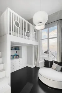 A modern bathroom featuring white concrete walls and floors, with a circular white bathtub and a white vanity cabinet.