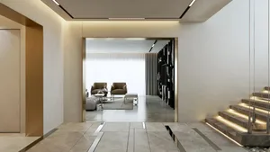 Modern living room with marble flooring and minimalist design elements.