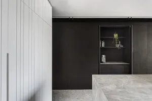 An image of a modern minimalist interior featuring wood and marble materials.