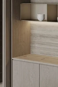 Modern kitchen featuring wooden cabinets and marble countertops