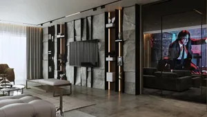 A modern living room featuring a concrete wall with embedded shelving and a television mounted on the wall.