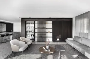 Modern living room with concrete, wood, and marble materials