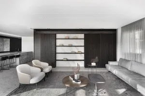 Contemporary living room featuring marble, wood, and concrete elements.