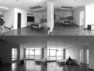 Modern living room featuring wooden furniture, white walls, and hardwood floors.