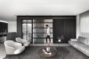 A modern living room featuring wood and marble materials.
