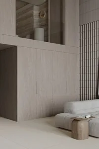 A modern minimalist living room featuring wood elements and a beige sofa with a wooden stool and a folded newspaper on top.