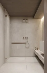 A modern, minimalist bathroom with textured tile walls and floor.