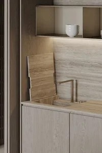 Modern kitchen featuring a marble countertop and wooden cabinets.