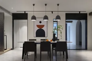 A modern dining room features a marble table surrounded by dark chairs, illuminated by pendant lights and a geometric wall ar