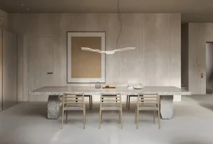 Modern dining room with a long, rectangular terrazzo-topped dining table surrounded by wooden chairs and a minimalist pendant