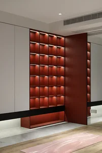 Modern interior design featuring metallic red shelving units.