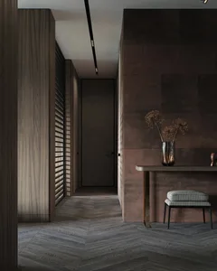 A modern entrance hall with wooden elements and a dark color scheme.