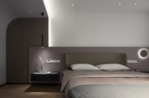 A minimalist bedroom with a sleek bed and floating nightstand.