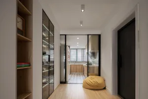 Modern minimalist residential interior with wooden and glass elements.