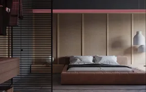 Modern bedroom with velvet furniture and wooden walls.