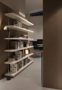 A modern home office with floating wooden shelves filled with books and decor.