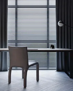 Modern home office featuring a wooden desk and chair with a minimalist design aesthetic.