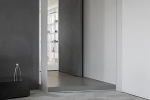Modern interior space featuring minimalist design and concrete elements.