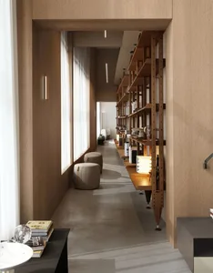 A modern, wooden-designed library corridor with shelves and seating.
