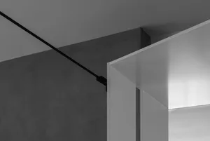 A modern interior with a minimalist design featuring smooth, clean lines and a combination of metal and leather materials.