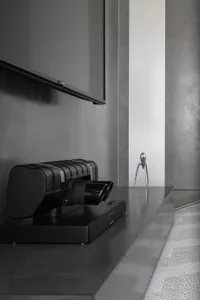 A sleek, modern kitchen with metallic elements and minimalist design.