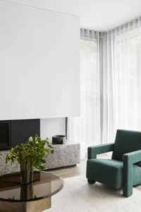 Modern living room featuring marble and glass elements