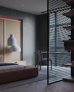 A modern minimalist bedroom with a single bed, white pendant lights, and a black lattice divider.