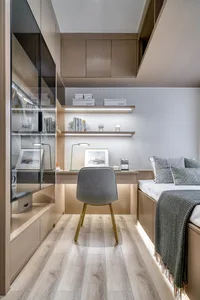 A modern minimalist bedroom with wooden flooring, furniture, and shelves. Features a working area with a desk, chair, and vis