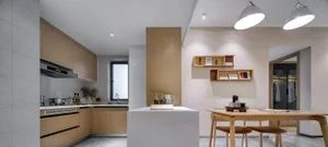 Modern minimalist kitchen with wooden cabinets, a central island, and a white countertop.