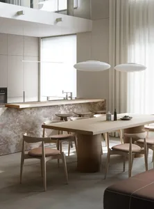 Modern residential kitchen featuring marble counter tops and minimalist design elements.