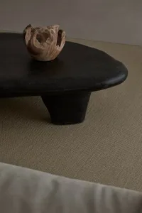 Modern coffee table with a black stone surface and minimalist design