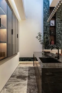 Contemporary kitchen featuring marble countertops and minimalist design elements.
