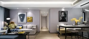 Modern living room with contemporary artwork on the walls, including abstract shapes and portraits.