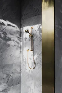 Modern minimalist bathroom with marble shower head.