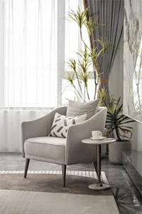 A modern fabric armchair in a contemporary living room setting, featuring minimalist design and plush seating.