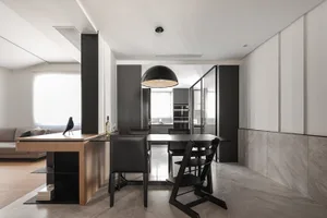 Modern minimalist kitchen with a breakfast bar made of wood and metal materials.