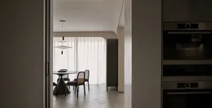 Modern residential kitchen featuring sleek concrete elements