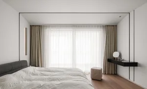 A minimalist bedroom with white curtains, wooden floor, and a modern bed.