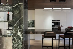 Modern kitchen with marble countertops and backsplash