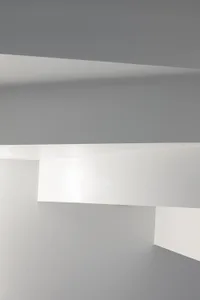 Modern minimalist interior with white and gray walls.