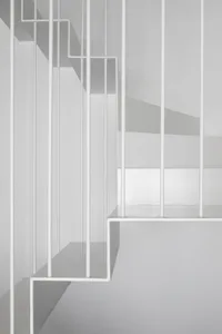 Stairs with modern minimalist design, made of metal, featuring clean lines and a sleek, contemporary aesthetic.