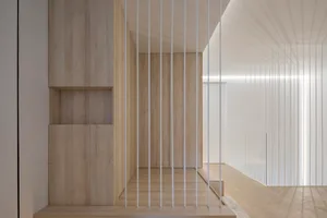 Interior design image of a modern minimalist living room featuring wooden walls and a white ceiling.