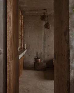A minimalist interior design featuring a concrete wall and floor with a wooden cabinet and window with blinds.