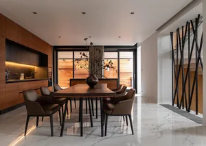 Modern dining room with wooden furniture and a marble floor.
