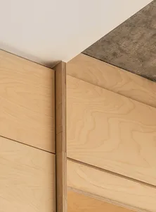 Modern interior design featuring wooden panels and geometric shapes.