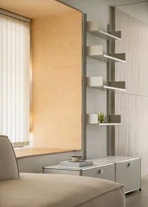 A modern minimalist living room featuring metal shelves.