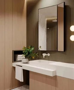 Modern bathroom with a white sink, a potted plant, and wooden paneling on the walls.