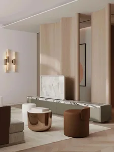 Modern minimalist living room with marble accent and brown furniture.
