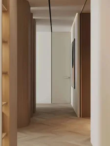 Minimalist interior design featuring wooden cabinetry against a white background, with a wall-mounted artwork and floor-to-ce