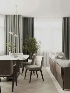 Contemporary living room featuring a marble coffee table surrounded by upholstered chairs and a modern sofa with pillows.